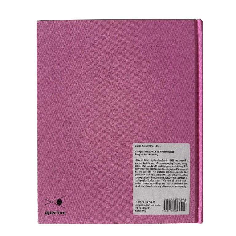 A pink hardback back cover of What's Ours by Myriam Boulos.