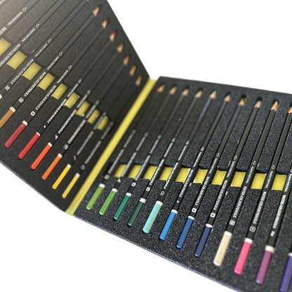 Set of watercolor pencils in a black case on a white background