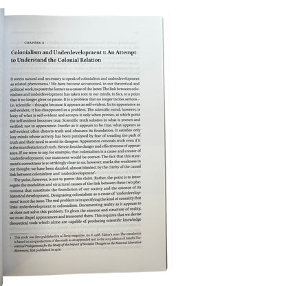 Book page from Arab Marxism and National Liberation with text on colonialism and underdevelopment