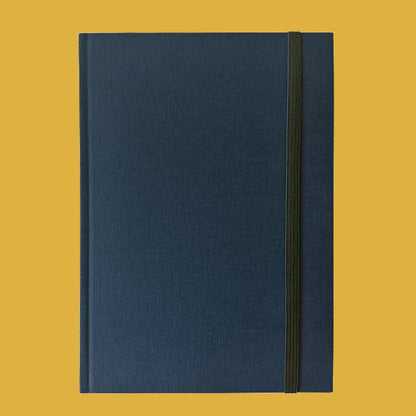 Blue notebook on a yellow background
