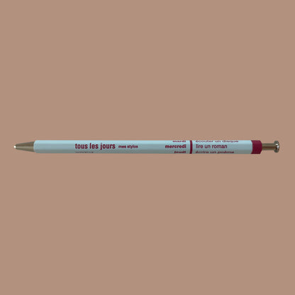Light blue pen against beige background