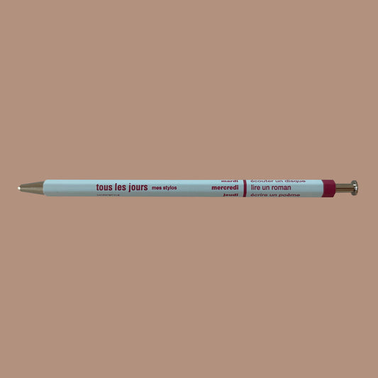 Light blue pen against beige background