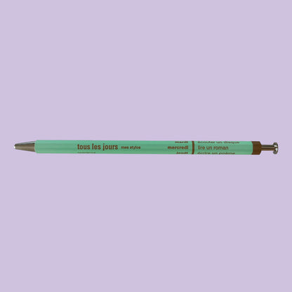 Light mint pen against lavender background