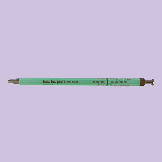 Light mint pen against lavender background