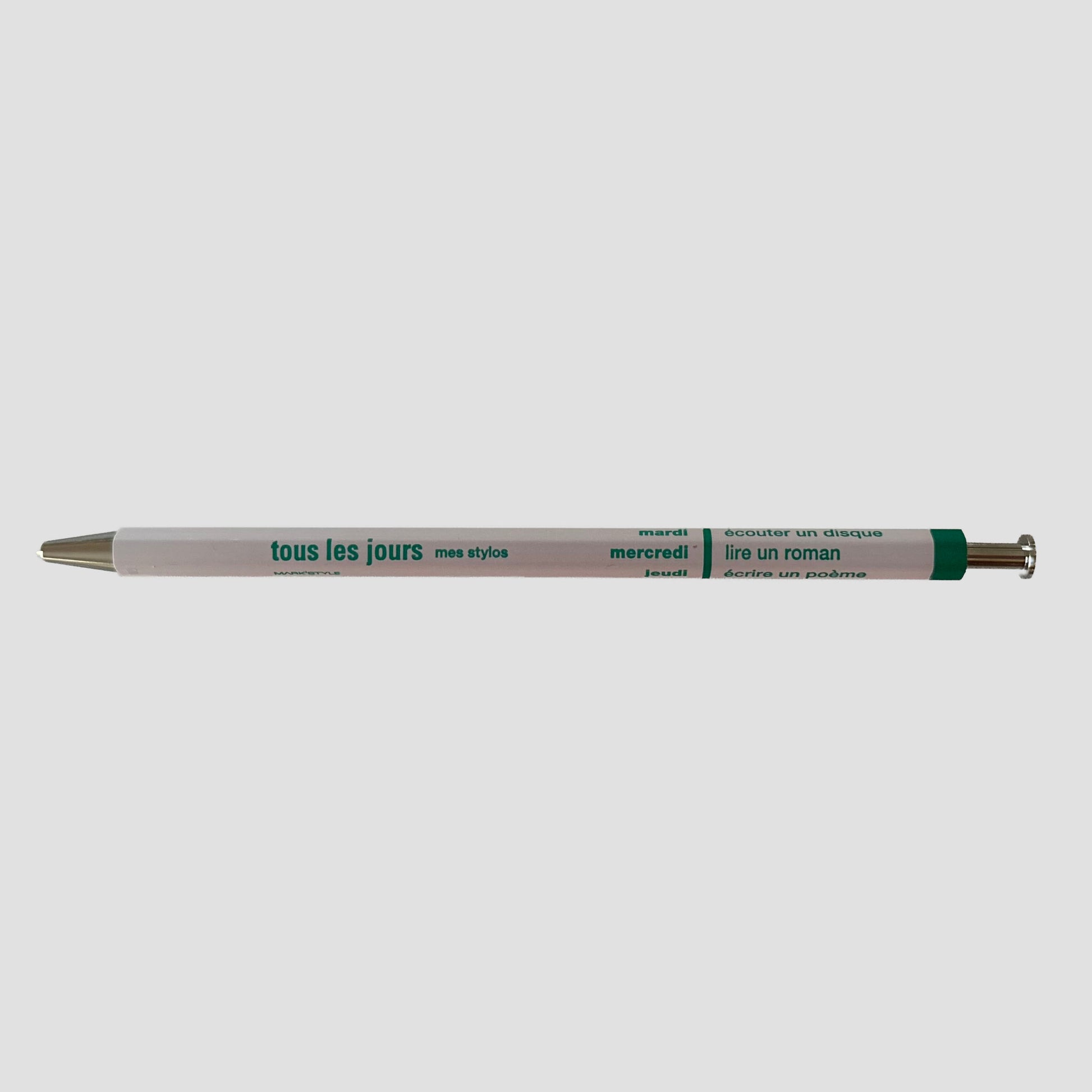 Light pink pen with visible branding on a white background