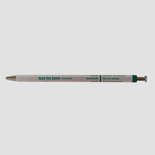 Light pink pen with visible branding on a white background