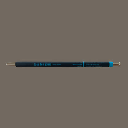 Navy pen against grey background.