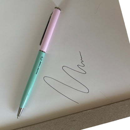 Pink and green pen on paper with ink drawing