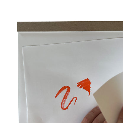 White drawing pad with orange design on a white background