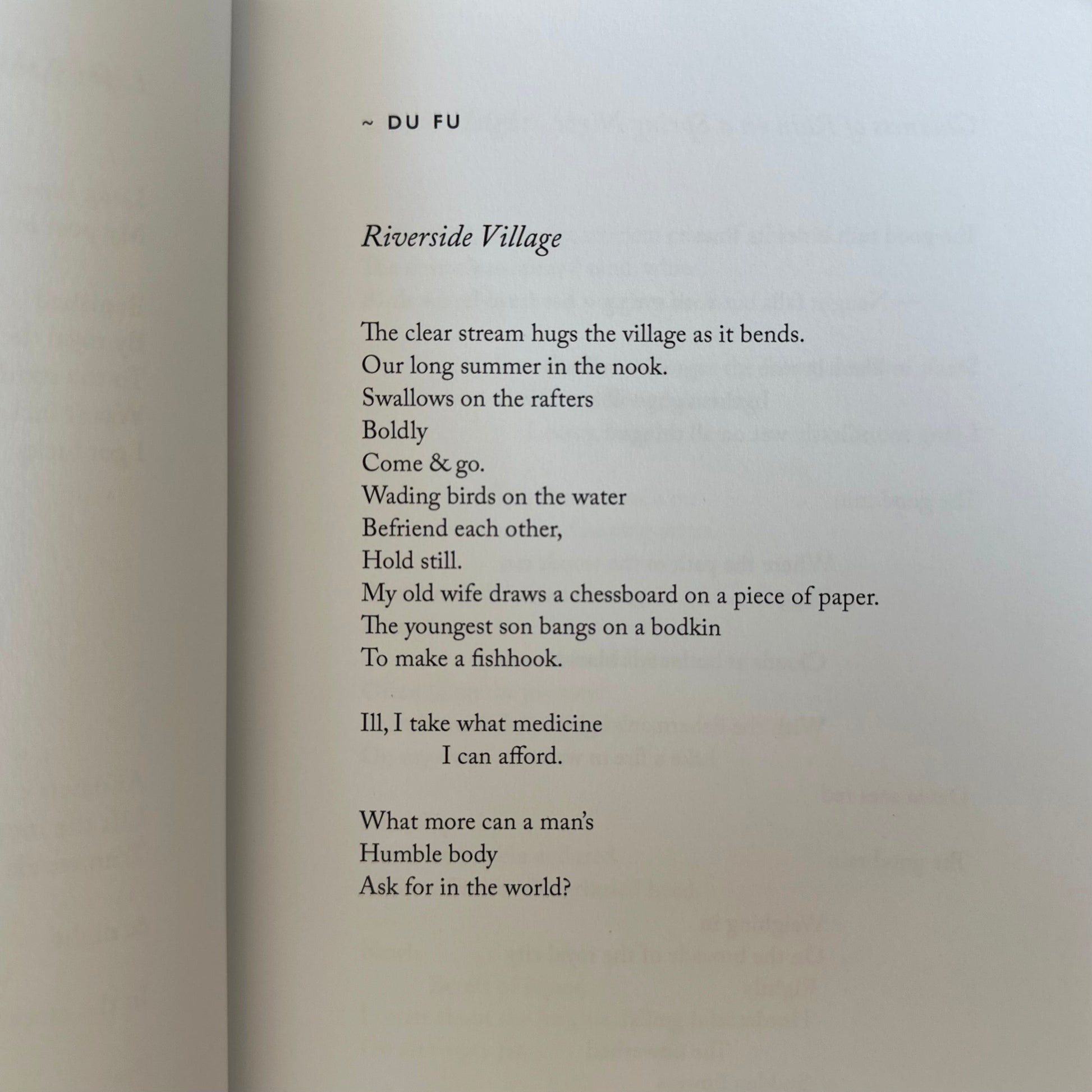 Poem by Du Fu titled 'Riverside Village' printed on a textured paper background.