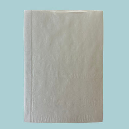 Light gray textured notebook on a light blue background