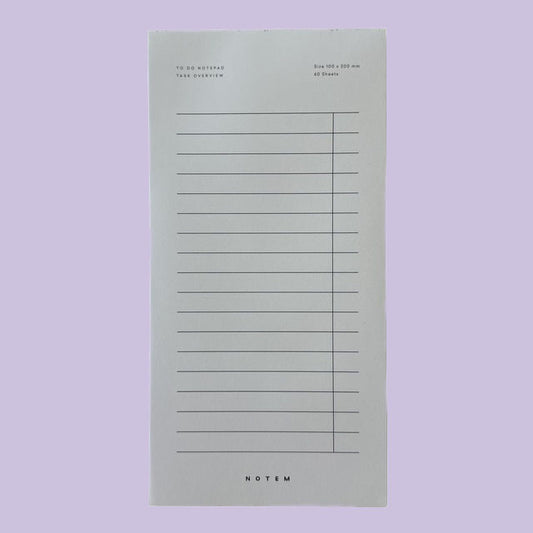 Notepad with lined pages on a light purple background