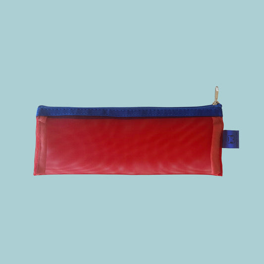 Red pencil case with blue zipper on a light blue background