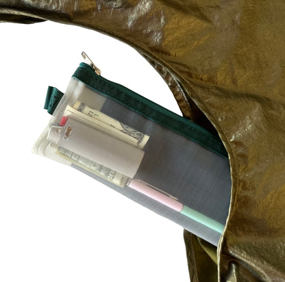 Yellow pouch with green zipper containing money and a pen in a gold bag.