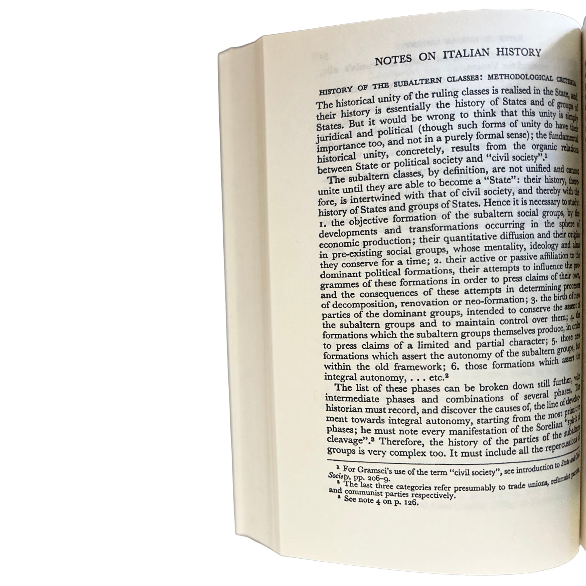 Open copy of Selections from the Prison Notebooks with text on Italian history on a white background