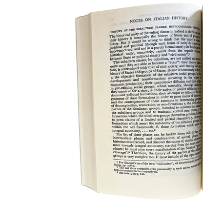 Open copy of Selections from the Prison Notebooks with text on Italian history on a white background