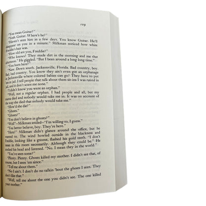 Open copy of Song of Solomon with text on a white background