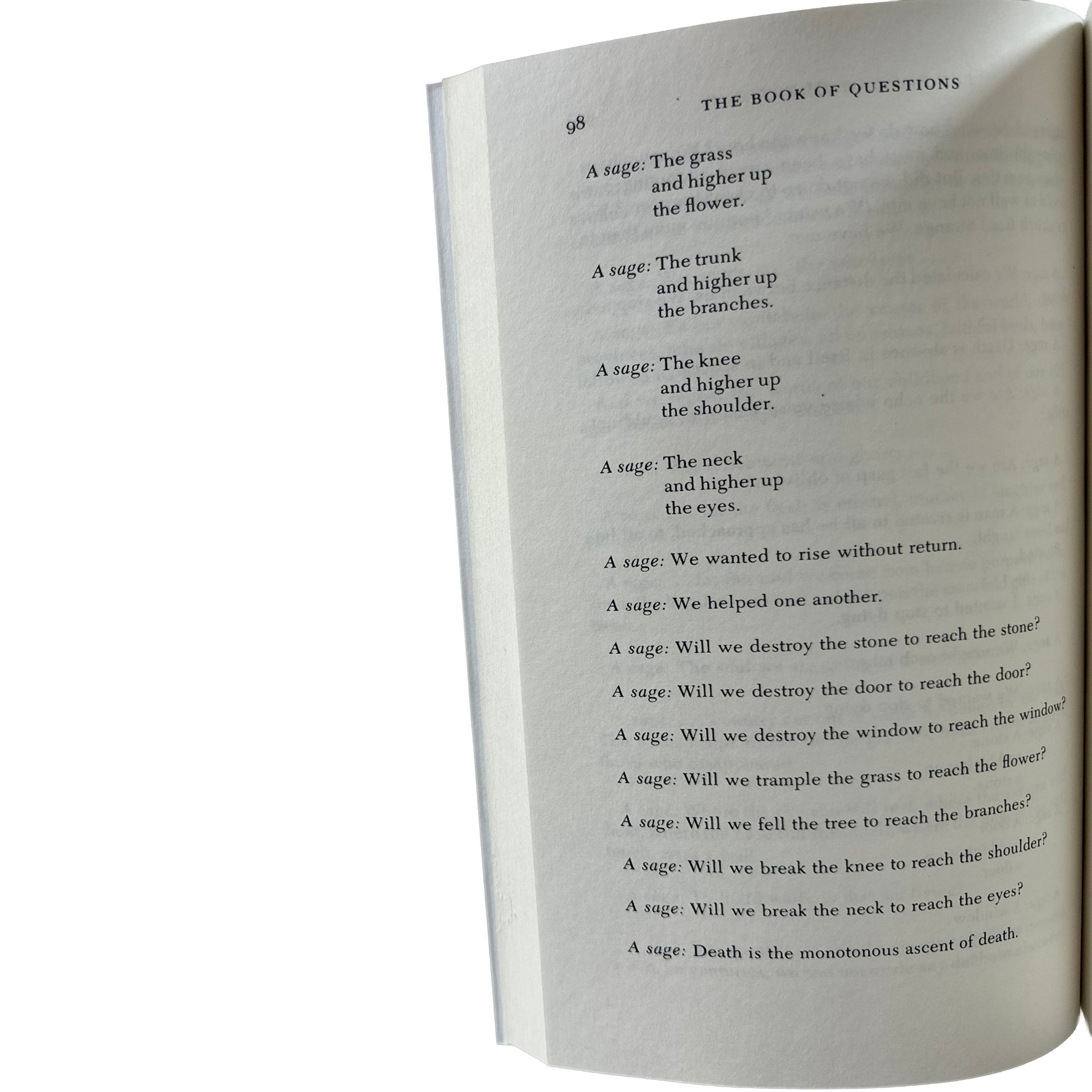 Open copy of The Book of Questions with text on a white background