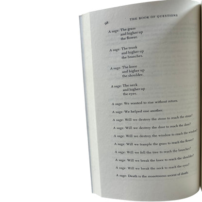 Open copy of The Book of Questions with text on a white background