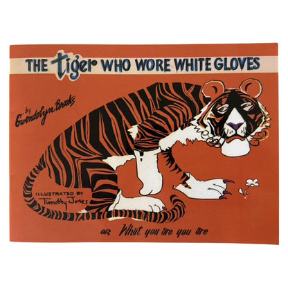 Book cover of 'The Tiger Who Wore White Gloves' with a tiger illustration on an orange background.