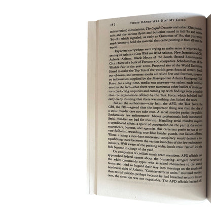 Open copy of Those Bones Are Not My Child with text on a white background